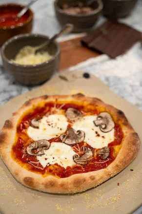 Emerson Pottery Handmade Olive Design Pizza Stone with Handles - For Even Baking and Serving